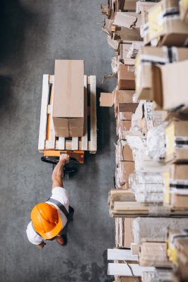 young-man-working-warehouse-with-boxes